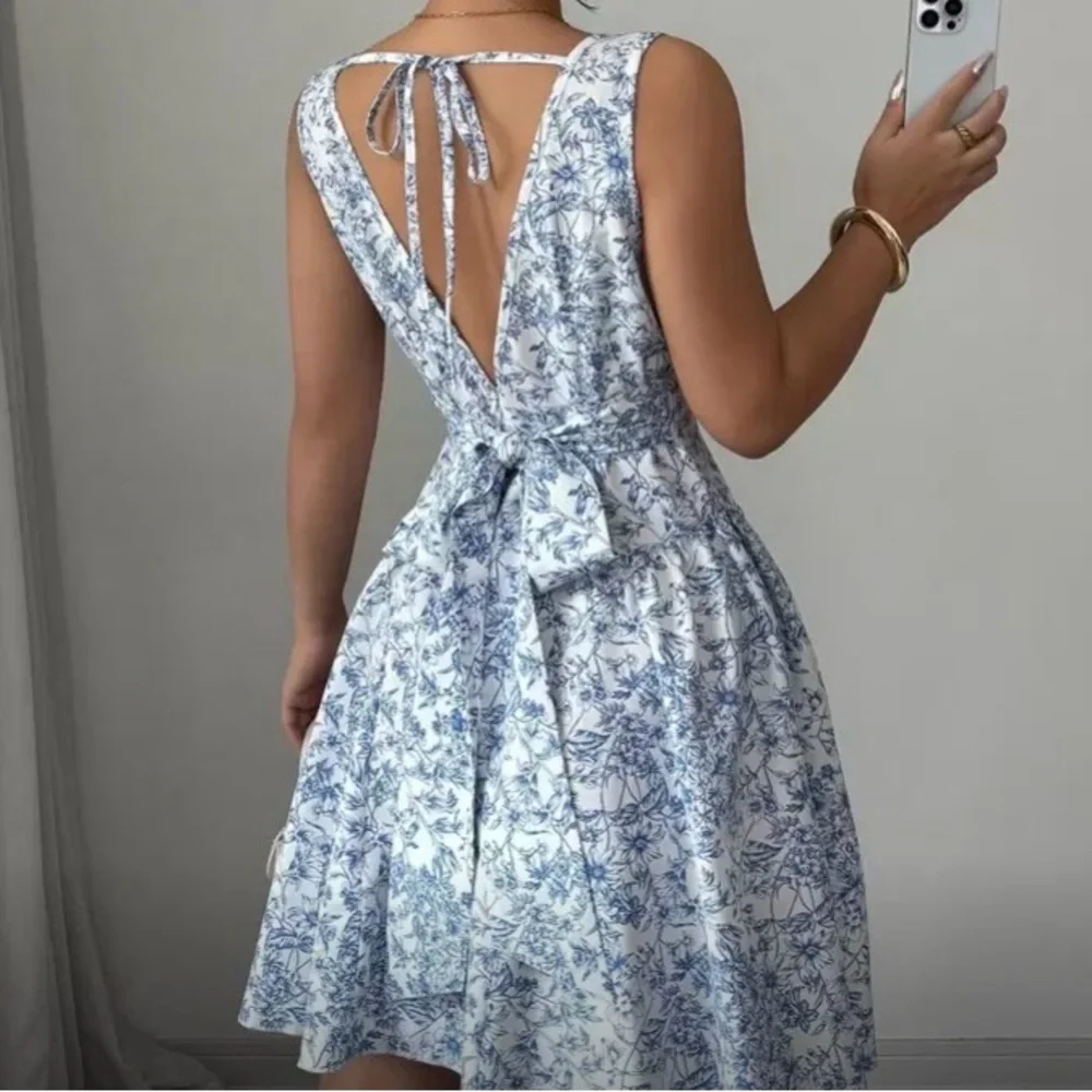 SHEIN Blue Floral Skater Dress Open Back Bow Tie Mini Dress - Picture 4 of 13